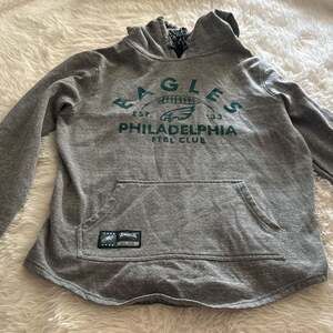 Philadelphia Eagles women’s Heather Grey Green Hooded Sweatshirt.    

Medium